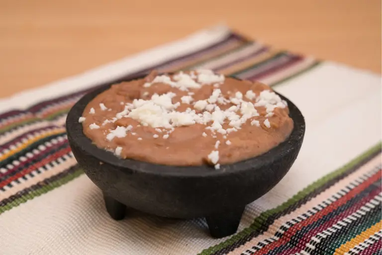 Huevos refritos con queso