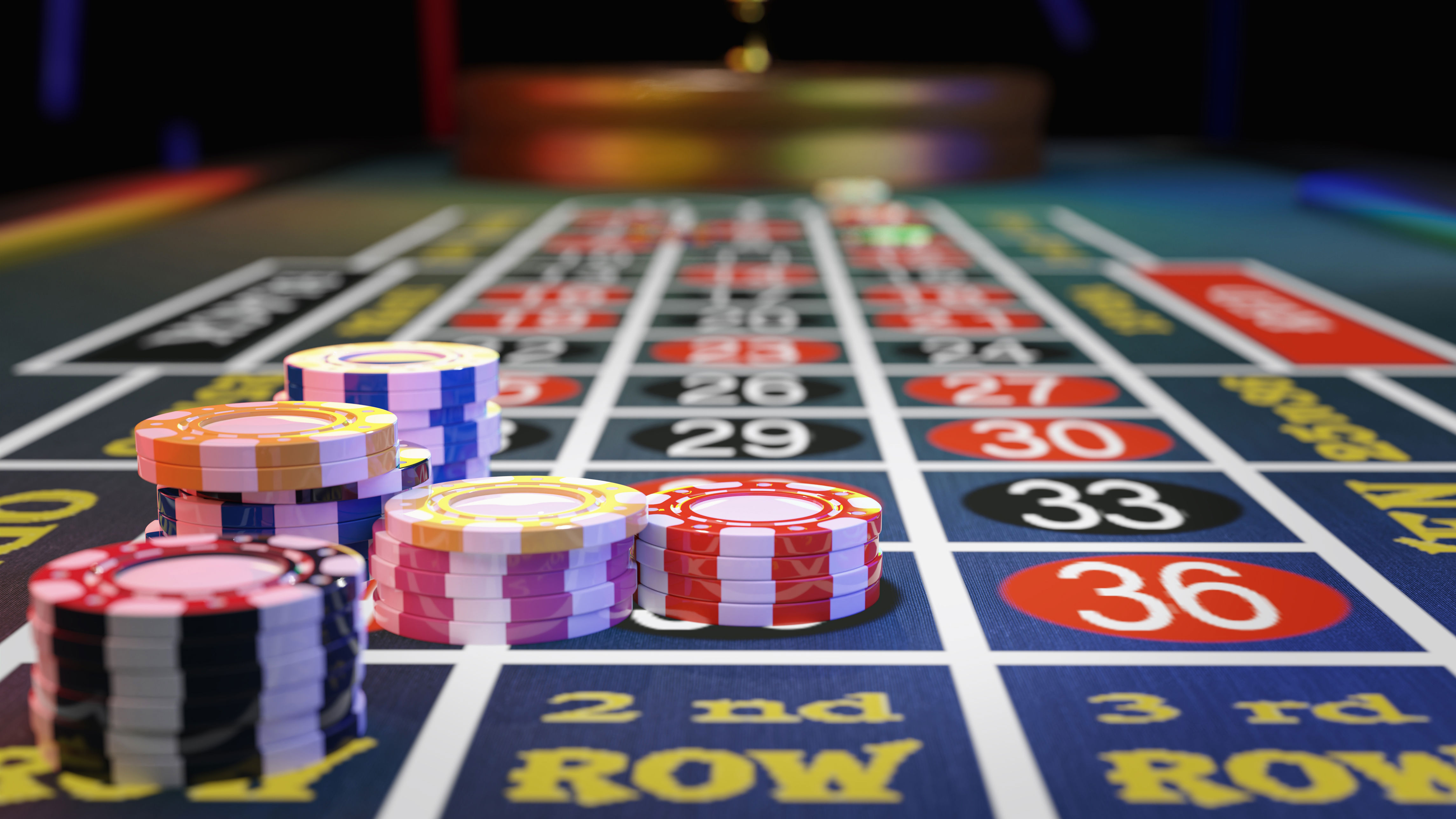 Casino roulette table with stacked chips placed on various numbers, indicating active bets in a gambling setting