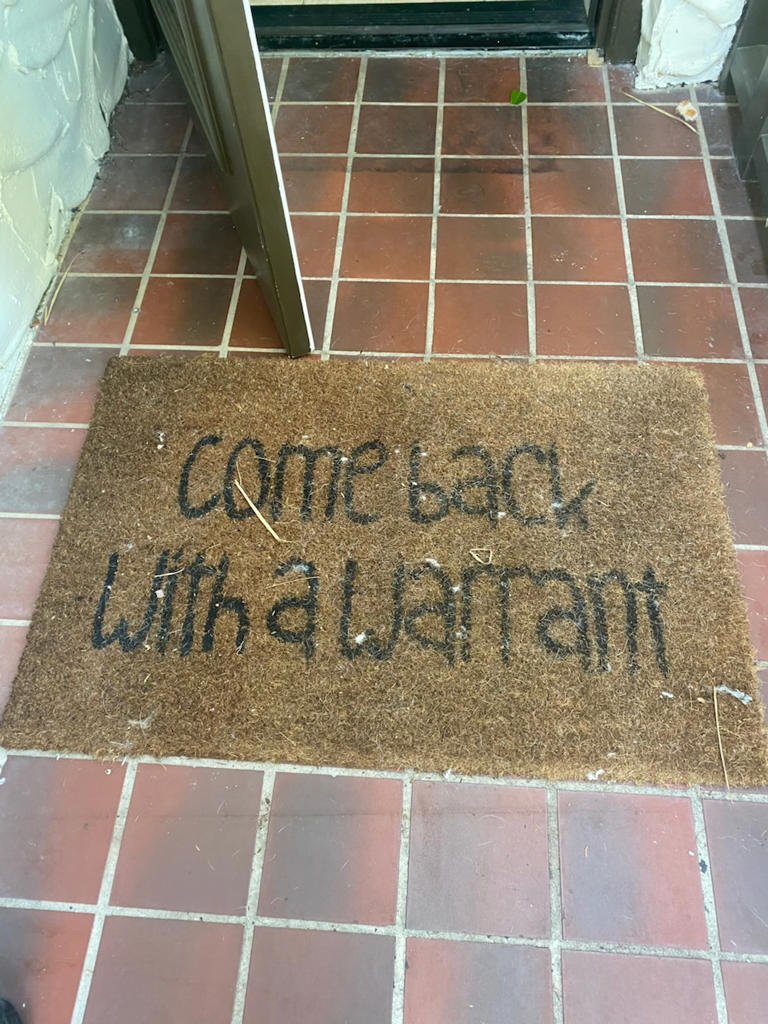 Authorities snapped a picture of Musick’s doormat, which read “come back with a warrant”. Volusia Sheriff's Office