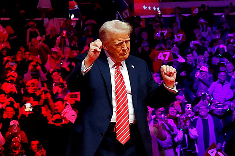 President-Elect Donald Trump dances on stage while the Village People perform 