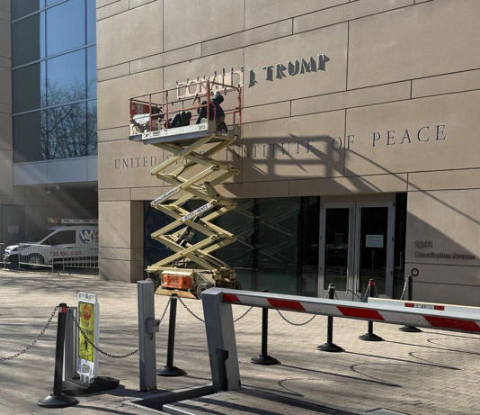 President Donald Trump��s name is added to the facade of the U.S. Institute of Peace building in downtown D.C.
