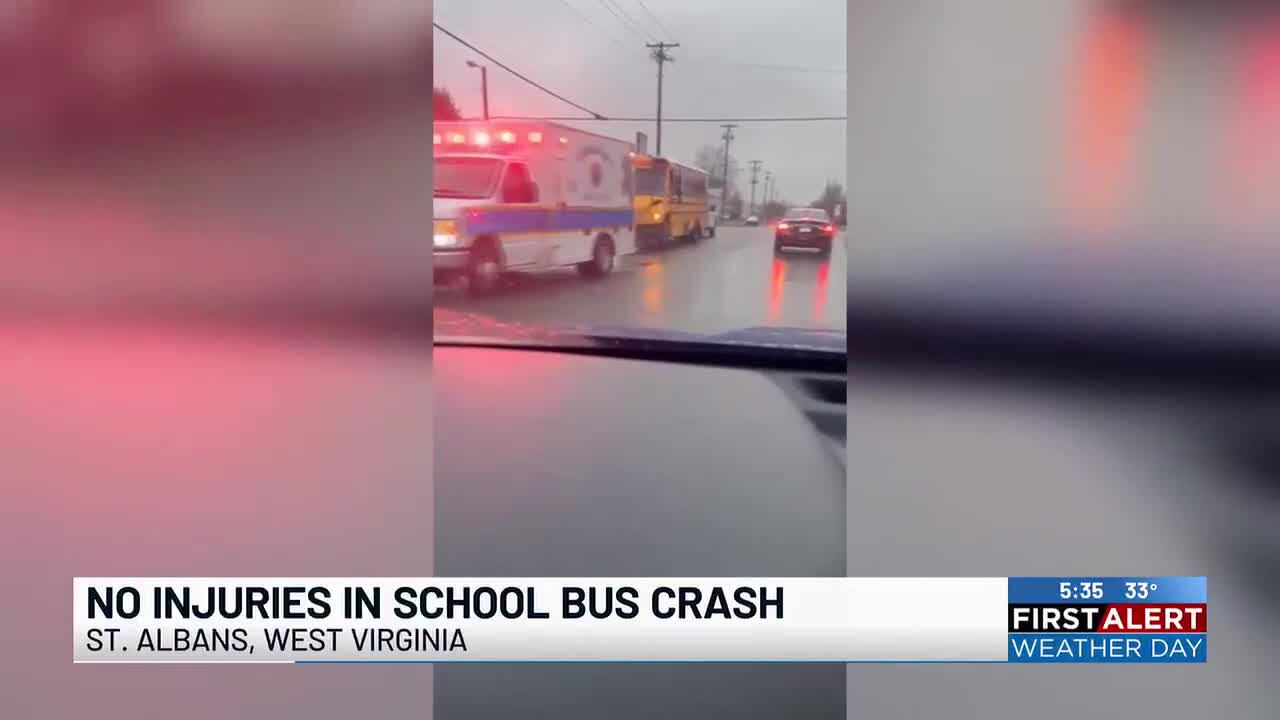 Two-vehicle crash involving school bus closes roadway; no injuries reported