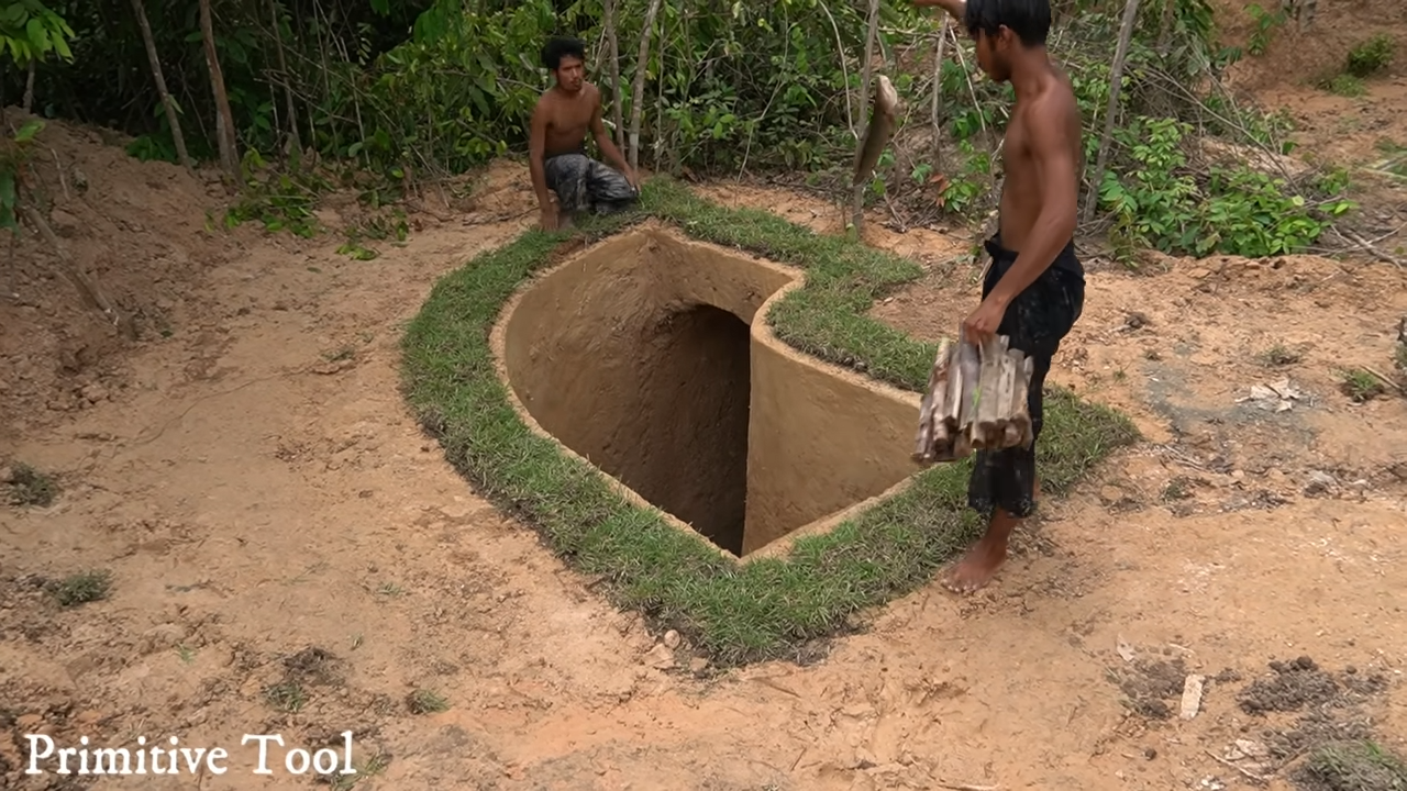 This underground home with a pool and decorated living room feels like ...