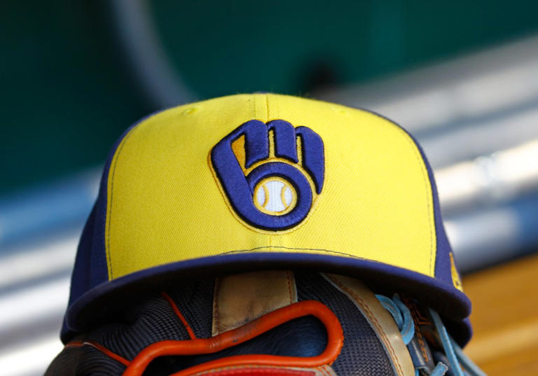 PITTSBURGH, PA – APRIL 22: A New Era Milwaukee Brewers baseball hat is seen on a Rawling baseball glove against the against the Pittsburgh Pirates at PNC Park on April 22, 2024 in Pittsburgh, Pennsylvania. (Photo by Justin K. Aller/Getty Images)