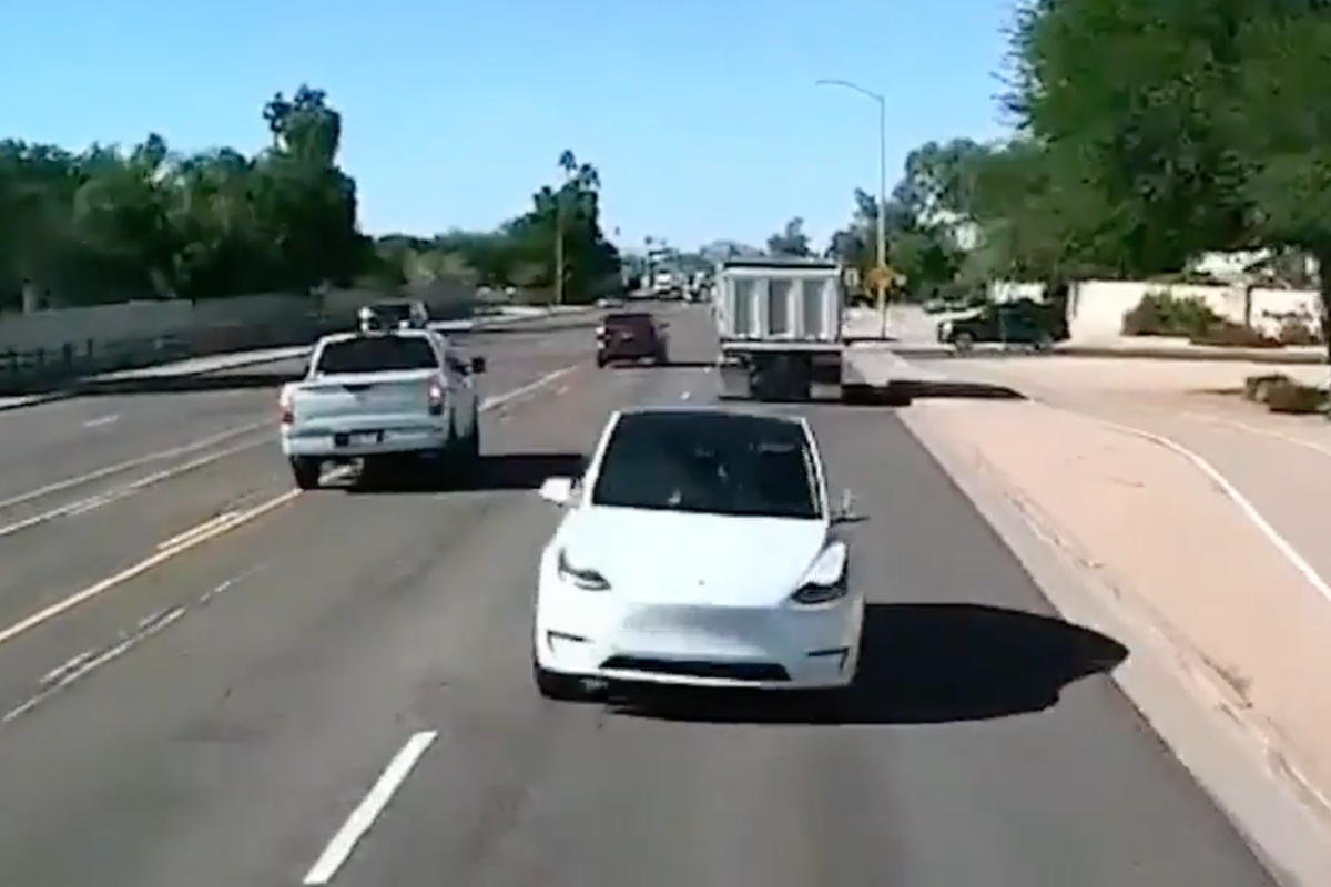 Tesla swerves into traffic causing dump truck to crash