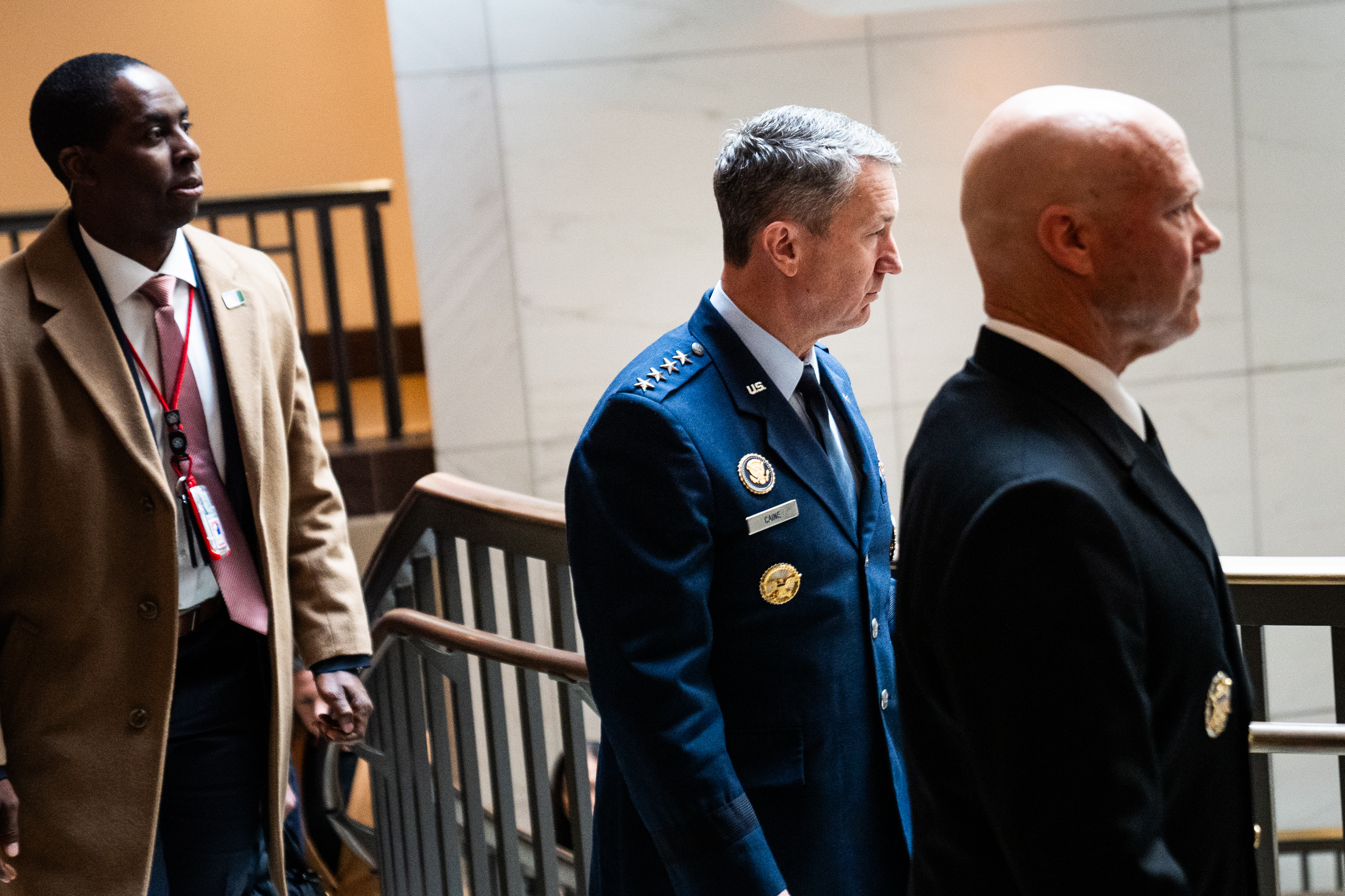 Joint Chiefs Chairman Gen. Dan Caine, in blue, escorts Adm. Frank Bradley to a classified meeting with lawmakers on Capitol Hill on Thursday.