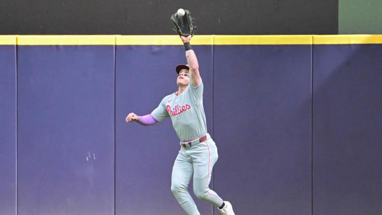 Sep 4, 2025; Milwaukee, Wisconsin, USA; Philadelphia Phillies center fielder Harrison Bader (2) catches a fly ball hit by Milwaukee Brewers second baseman Andruw Monasterio (not pictured) in the second inning at American Family Field. Mandatory Credit: Benny Sieu-Imagn Images | Benny Sieu-Imagn Images