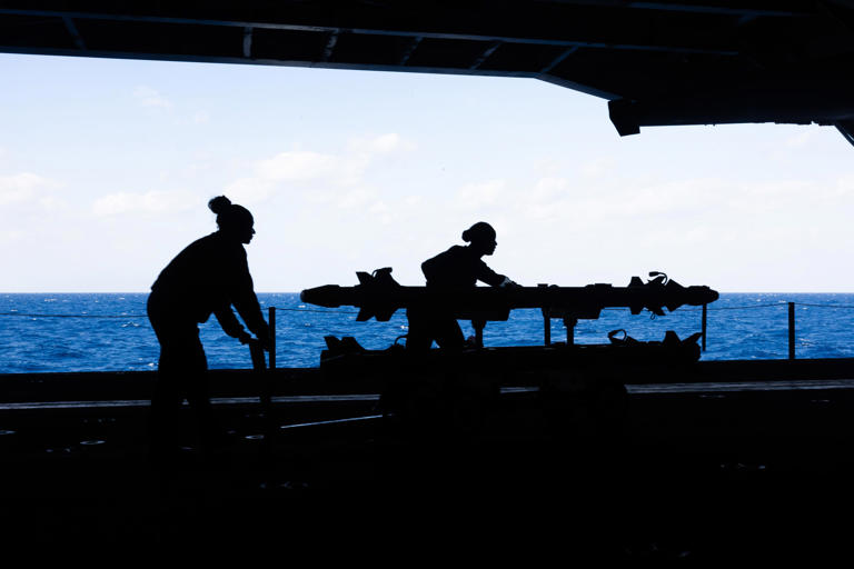 The hangar bay is an area underneath the flight deck where aircraft receive maintenance. US Navy photo
