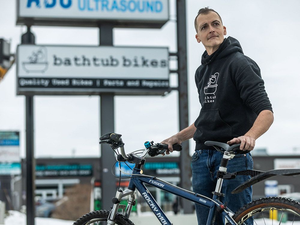 Owner of Bathtub Bikes celebrates new business sign after five-year wait
