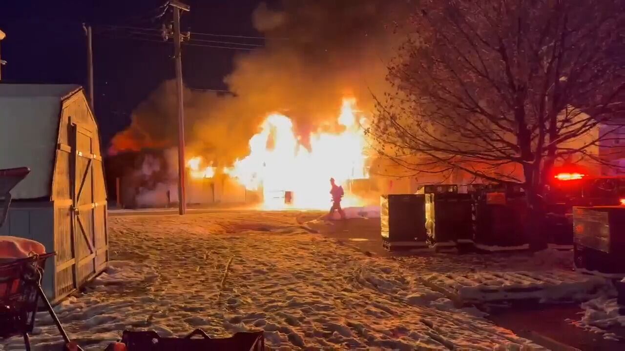 Flames, smoke fill air as firefighters battle garage fire in Springfield