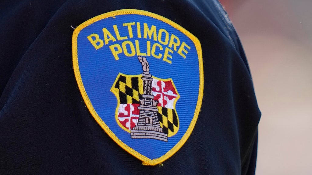 Baltimore police detective hospitalized after being struck by patrol car