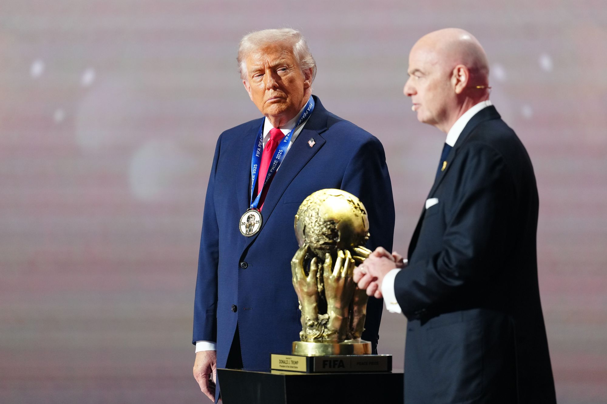 Donald Trump on stage with Gianni Infantino at the World Cup draw (Getty Images)