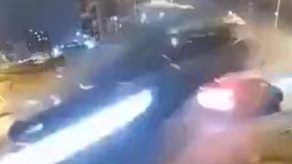 Spectacular: Car flies over roundabout and two other vehicles