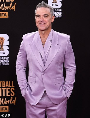Robbie wore his salt and pepper locks in spikes as he completed the look with a pair of shiny black dress shoes