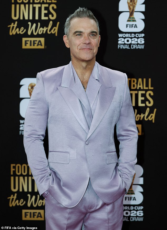 The football fan appeared delighted ahead of the draw