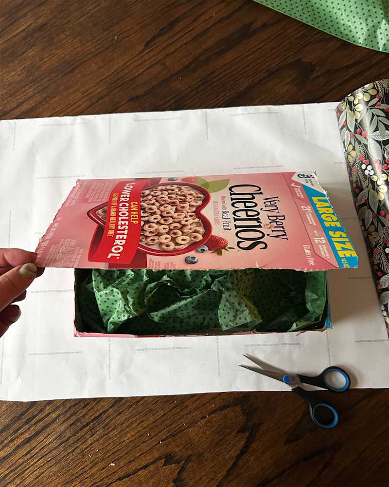 Top flap of cereal box cut to make a gift wrap box.