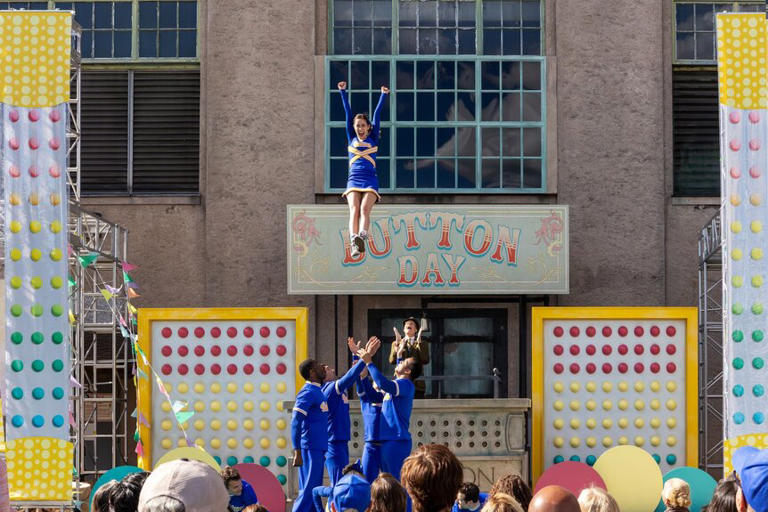 A cheer team does a stunt at 