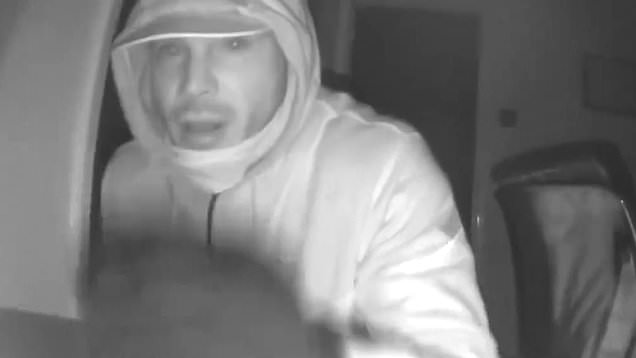 Moment burglar realises he has been caught on camera