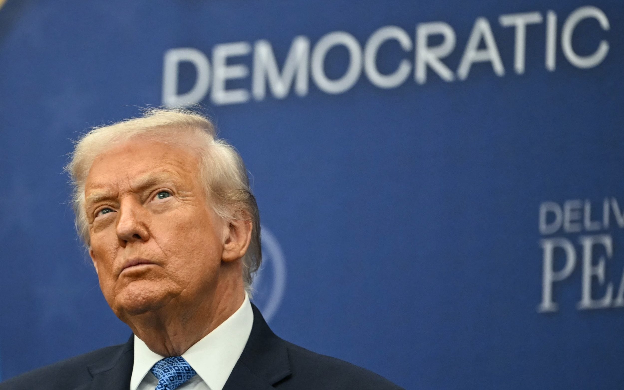 US President Donald Trump attends the signing ceremony of a peace deal with the President of Rwanda Paul Kagame and the President of the Democratic Republic of the Congo