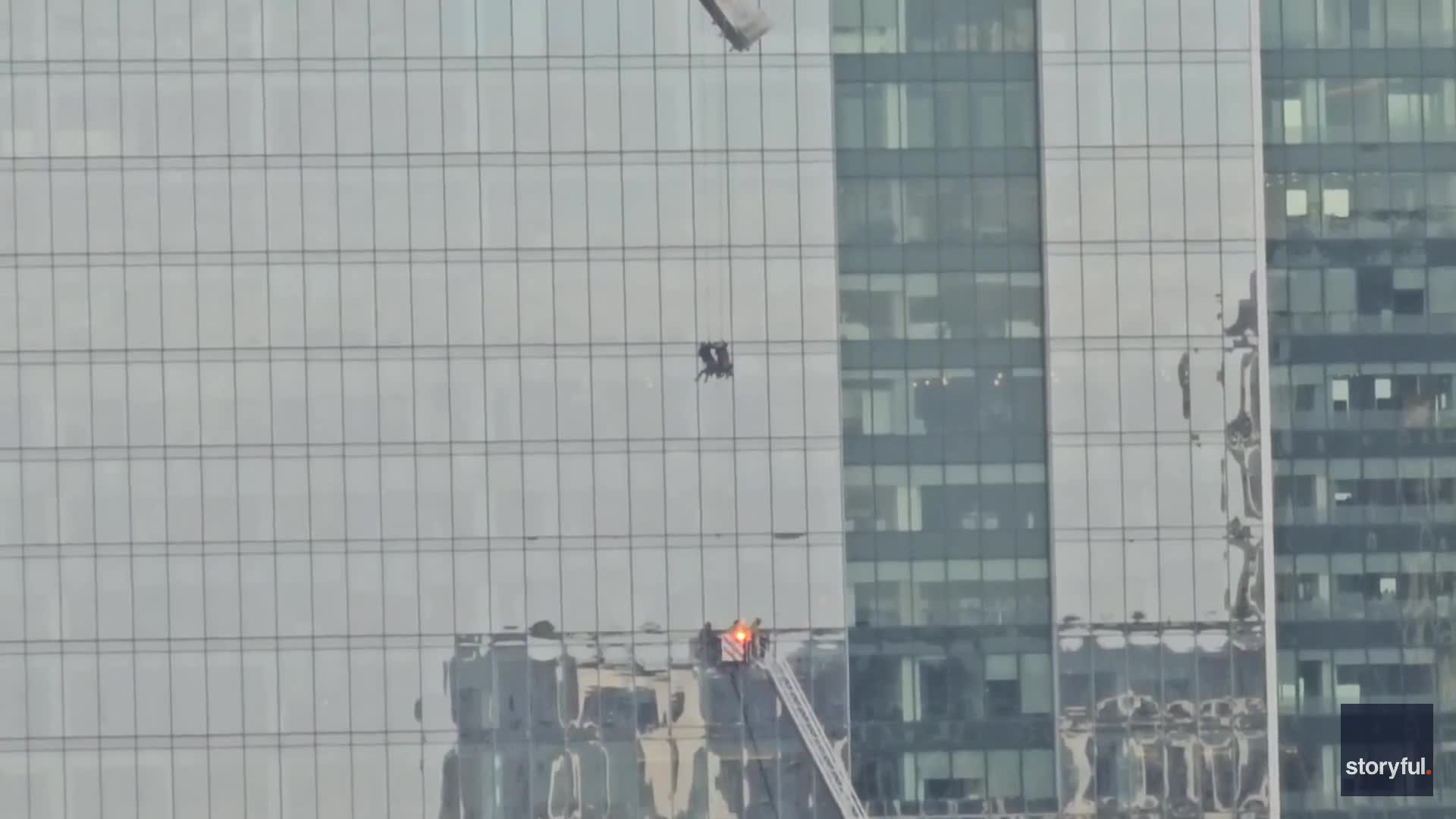 Firefighters make 'amazing' rescue of workers trapped in window washing ...