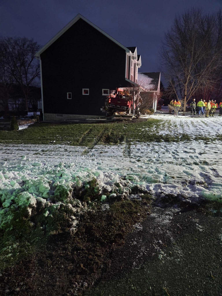 Pickup truck crashes into volunteer firefighter's home