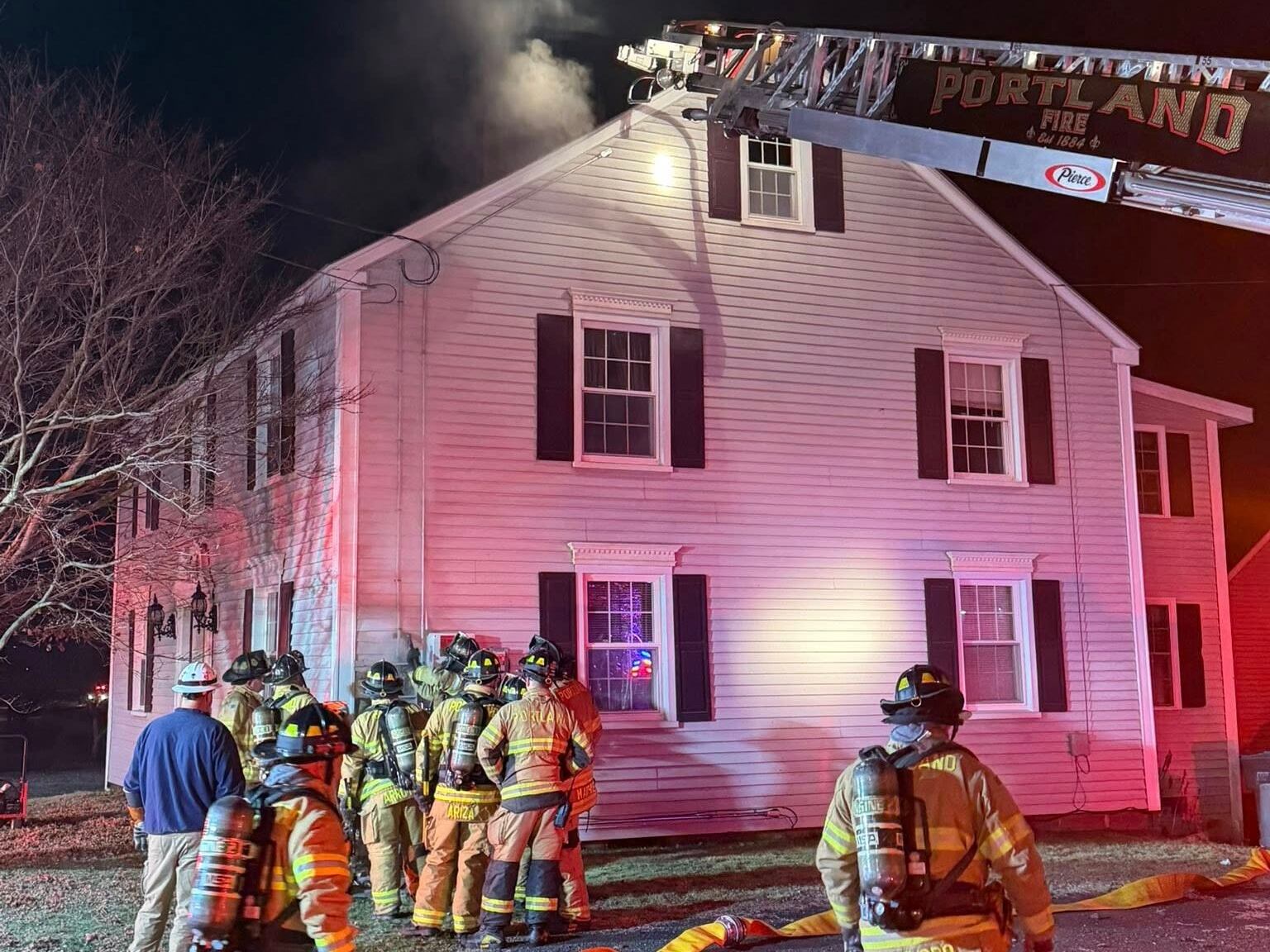 Firefighters work to put out Portland house fire