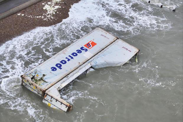Two fallen containers from ship off East Wight wash up on mainland photos