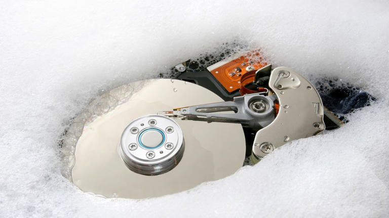 A hard drive sinking in soap suds