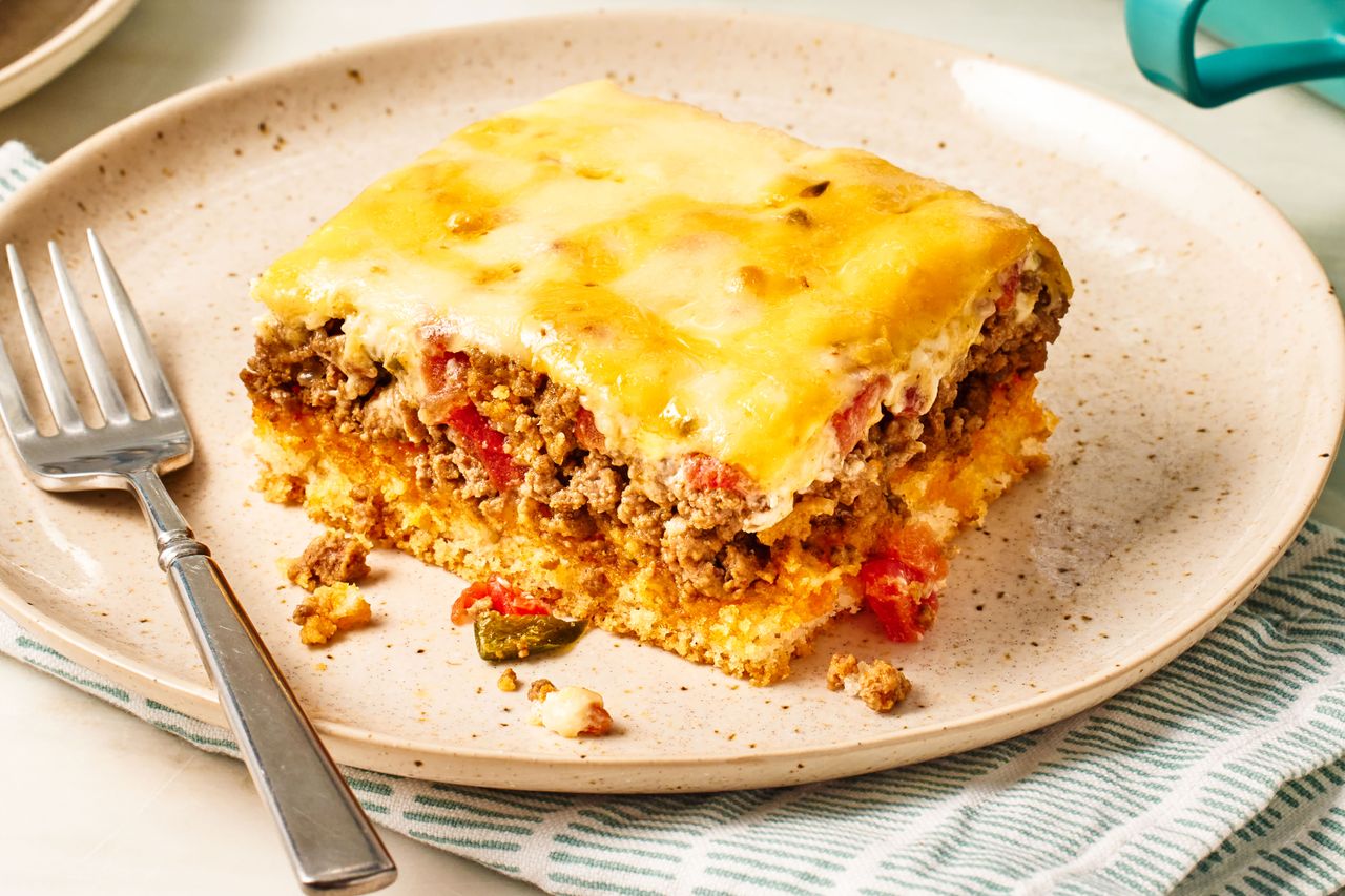 slice of Cattle Drive Casserole on a plate with a fork