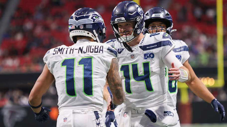 Dec 7, 2025; Atlanta, Georgia, USA; Seattle Seahawks wide receiver Jaxon Smith-Njigba (11) and quarterback Sam Darnold (14) celebrate after a touchdown against the Atlanta Falcons in the fourth quarter at Mercedes-Benz Stadium. | Brett Davis-Imagn Images