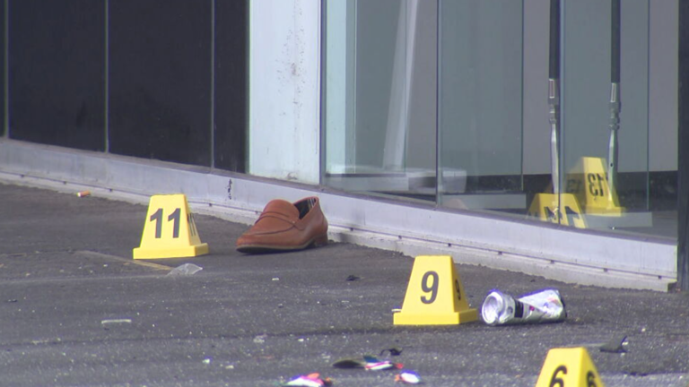 Man killed, woman injured after car veers over footpath and through ...