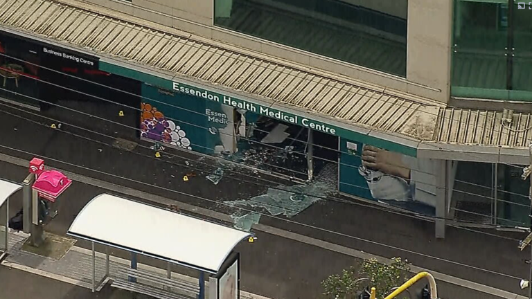 Man killed, woman injured after car veers over footpath and through ...