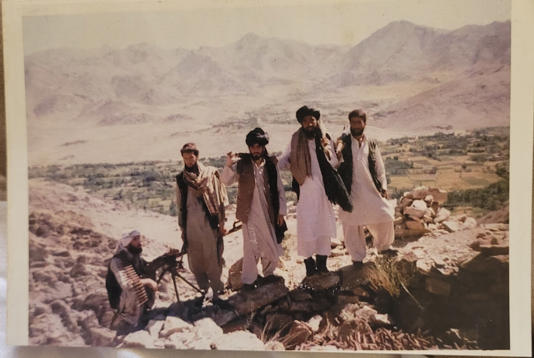 Maiwand Banayee, extreme right, with fellow Taliban fighters at Kharote village (Supplied)