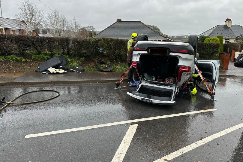 Driver reported after woman trapped in overturned car