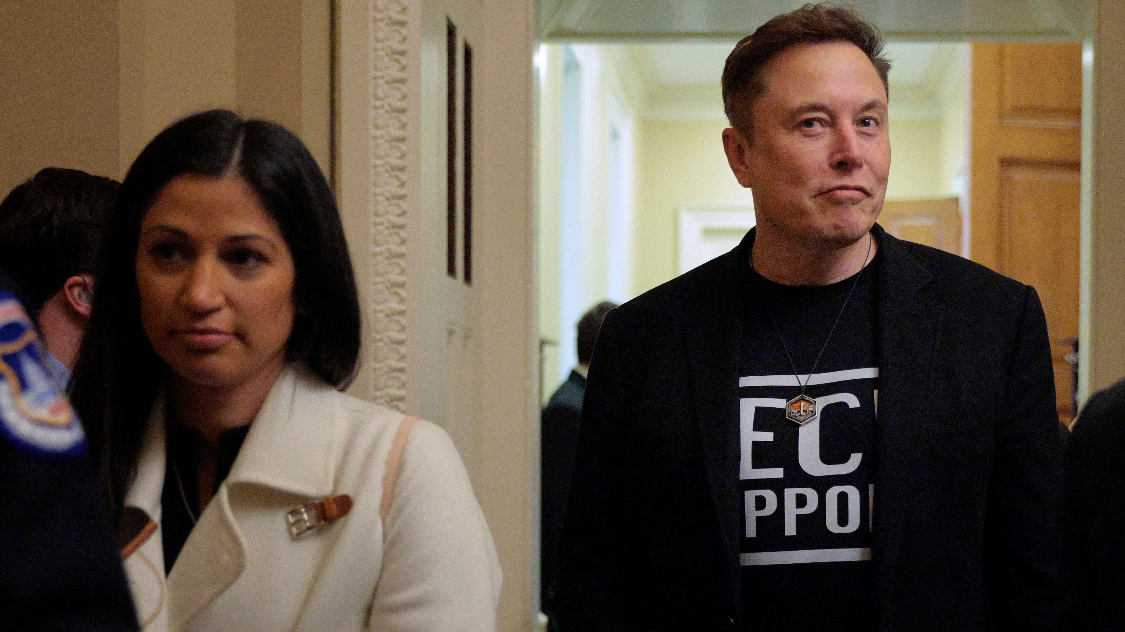 Elon Musk accompanied by DOGE adviser Katie Miller (left) leave a meeting with Senate Republicans on March 05, 2025. / Chip Somodevilla / Getty Images