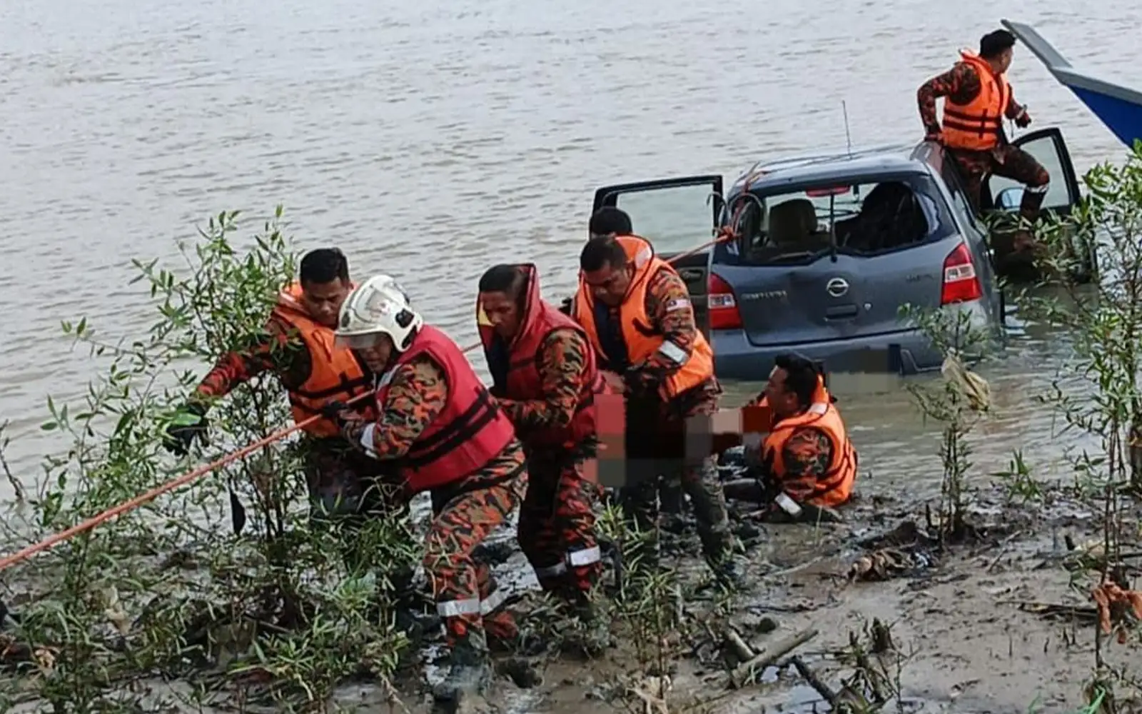 Woman dies after car plunges into river in Johor