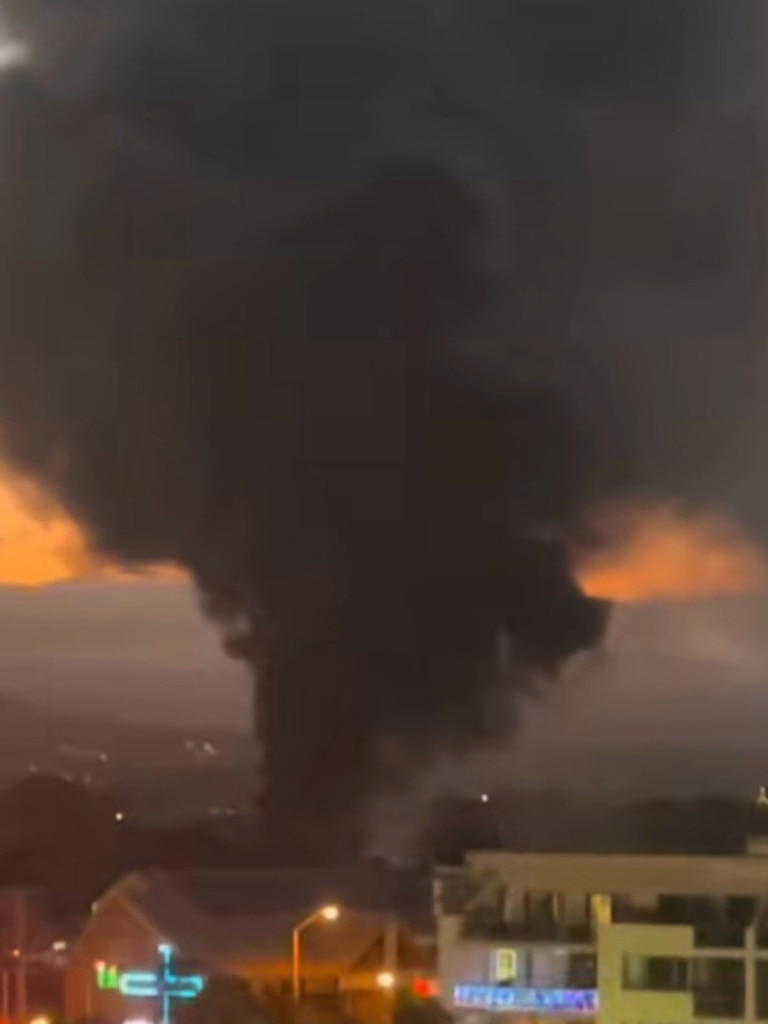 Fire rips through shop, sparks emergency