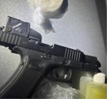 Street gang member found with drugs, cash, stolen firearm