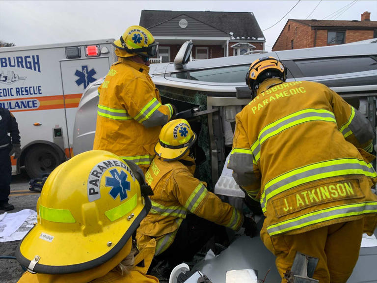 Rescue crews remove car's roof to free trapped driver after rollover in ...