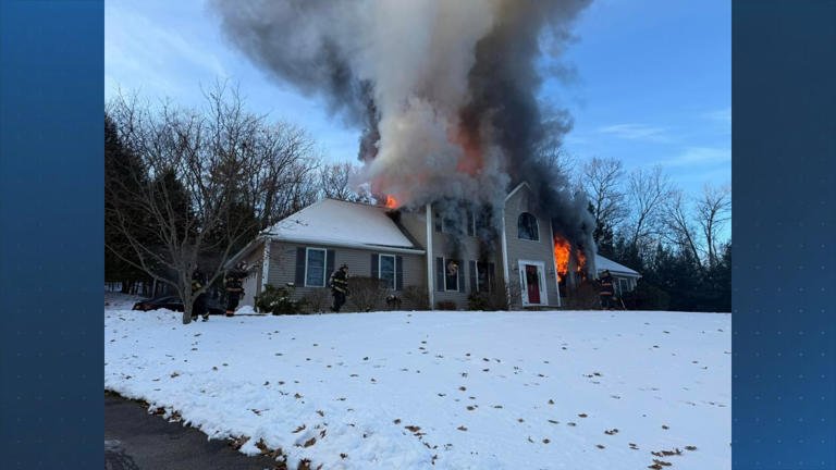 Crews battle large house fire in Tyngsboro
