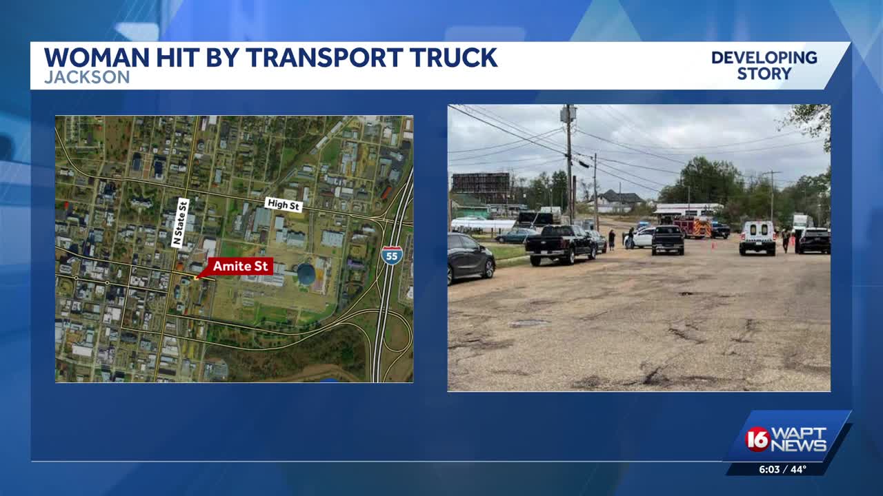 Woman critical after being struck by truck