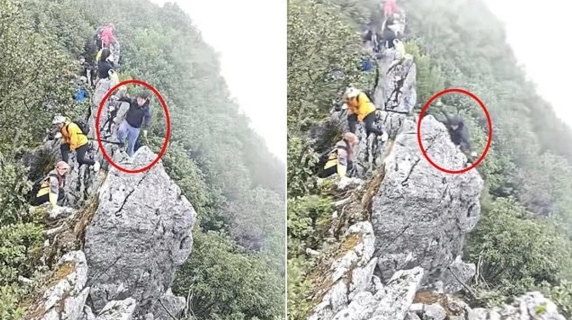 Il momento choc in cui un escursionista precipita da una scogliera ...