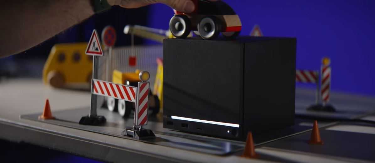 Valve's Steam Machine, as it is surrounded by a toy car and driving accoutrements.