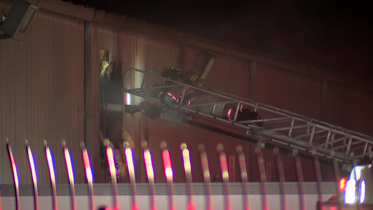 Over 100 firefighters respond to commercial building fire, officials say