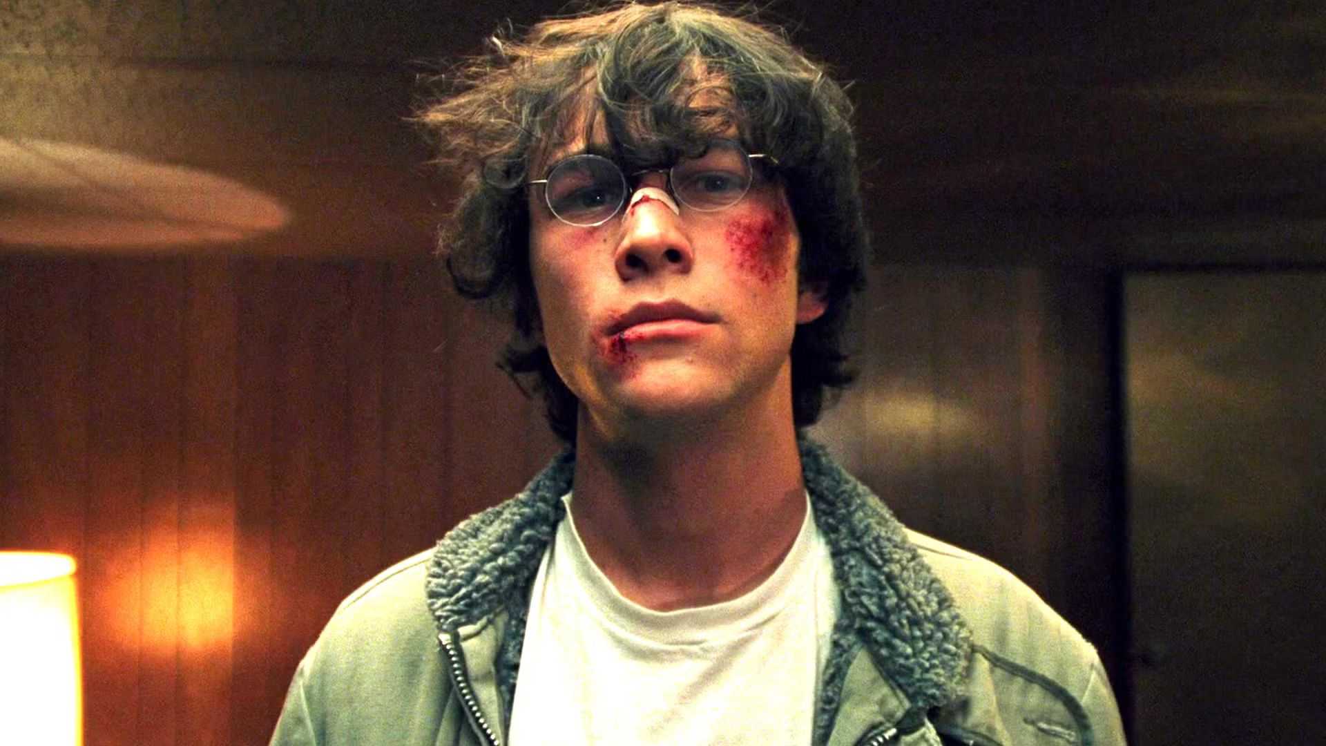 Joseph Gordon-Levitt as Brennan looking intense with his face beaten up in The Pin's basement in Brick