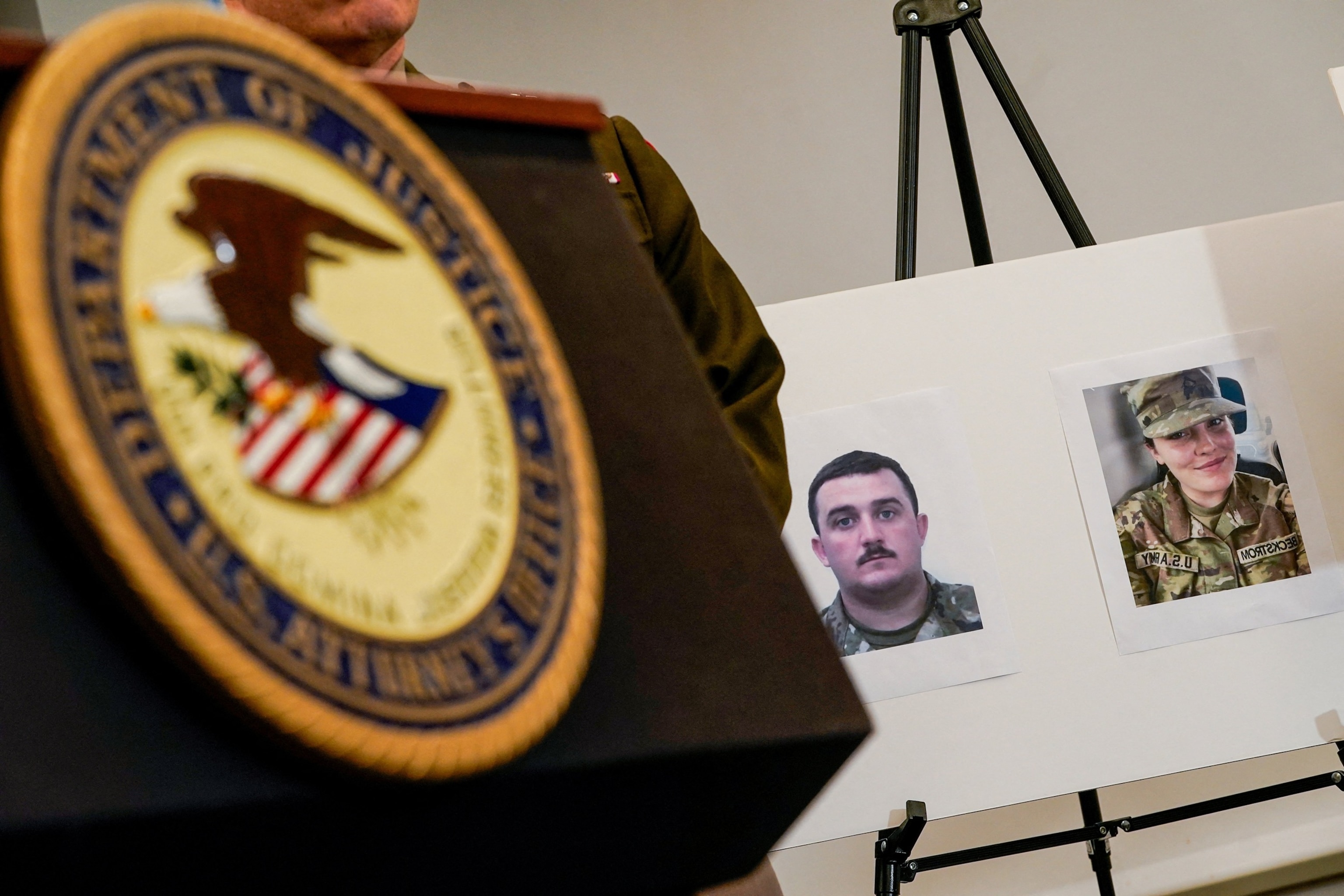 Nathan Howard/Reuters - PHOTO: Pictures of two National Guard members who were shot in Washington, D.C. are displayed at a press conference with FBI Director Kash Patel, attorney Jeanine Pirro and other authorities in Washington, D.C., Nov. 27, 2025.