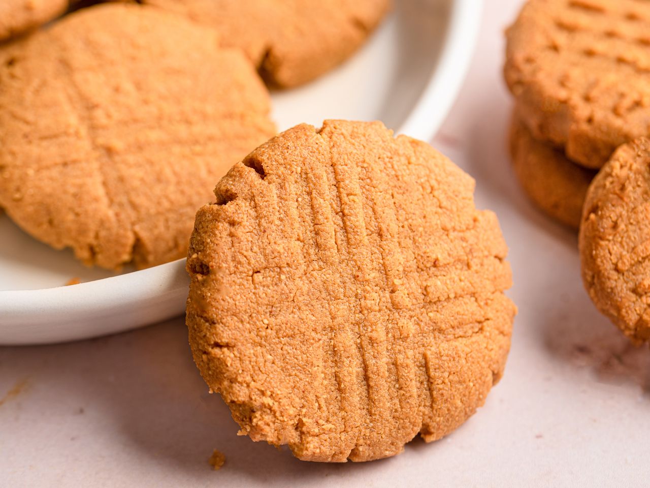 a close up view of a pile of freshly baked peanut butter cookies