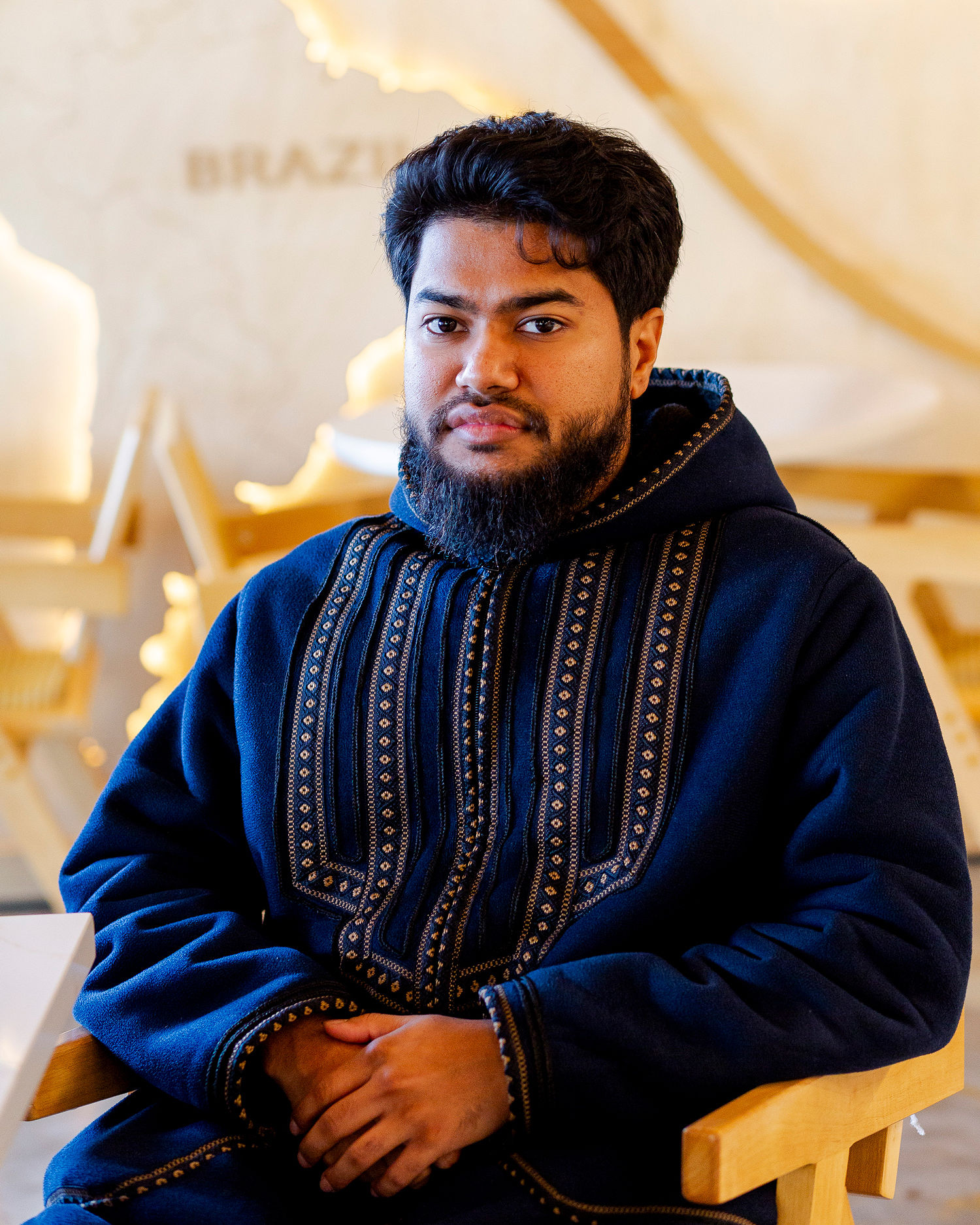 Riduan Rafique, 28, who has three jobs, said he's trying not to spend too much money in the current moment. (Sylvia Jarrus for NBC News)