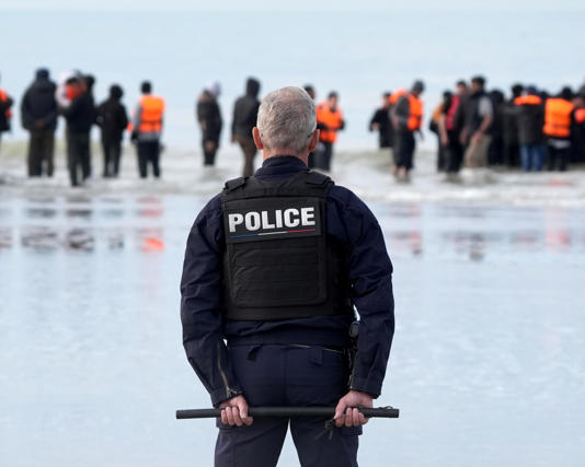 People attempting to board a small boat in Gravelines, France. Asylum seekers say lorry route is increasingly being offered to them by smugglers. Photograph: Gareth Fuller/PA