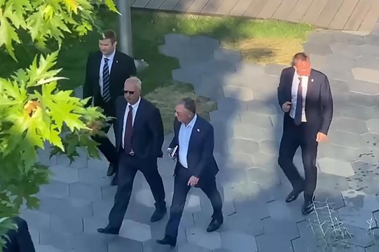 Witkoff and Dmitriev stroll through a Moscow park in August.